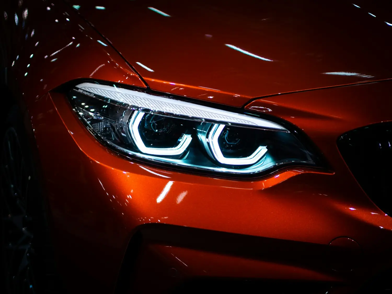 Red car headlight close up